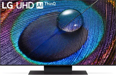 A close-up of an LG television screen displaying a peacock feather with a water droplet.