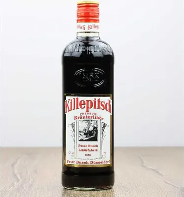 A bottle of Killepitsch liqueur is shown against a plain background.