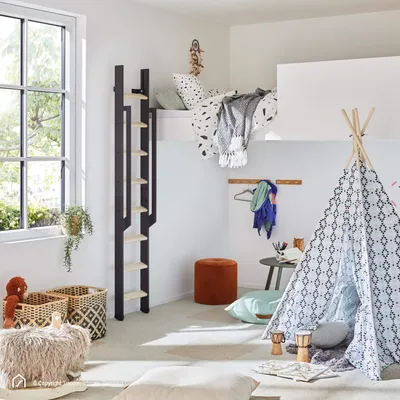 A child's bedroom with a loft bed, a teepee tent, and various decorative items.