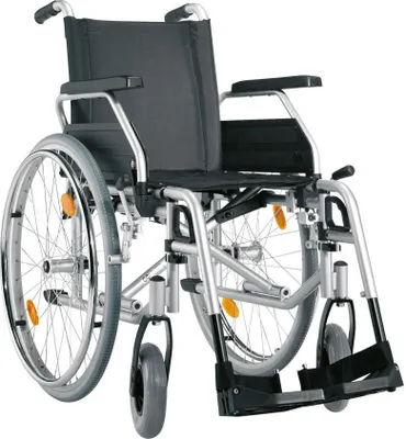 A studio shot of a wheelchair against a white background.