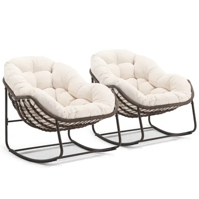 Two rocking chairs with cream cushions on a white background.