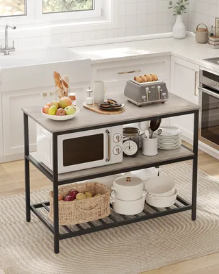 A kitchen island with various kitchen appliances and food items.