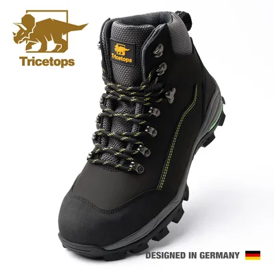 A studio shot of a black work boot with green accents.