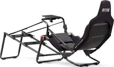 A black racing simulator cockpit with a seat and frame, shown against a white background.
