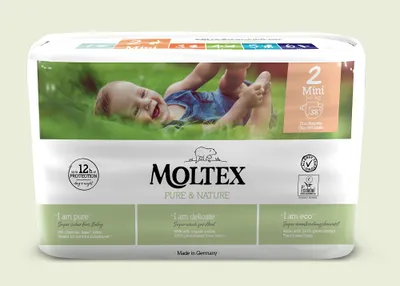 A package of Moltex Pure & Nature diapers with a baby lying on grass.