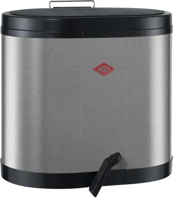 A silver and black Wesco trash can with a pedal mechanism.