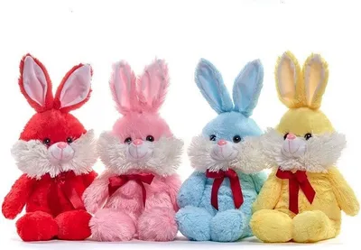 Four plush bunny toys in different colors arranged in a row against a white background.