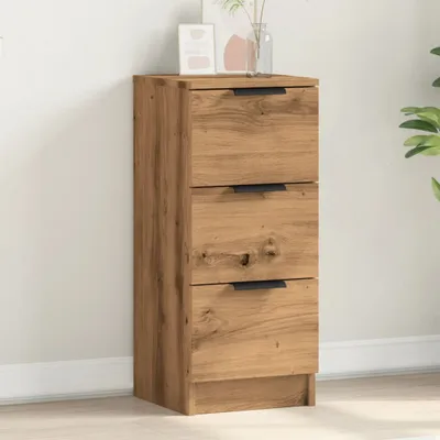 A wooden sideboard with three drawers against a white wall.