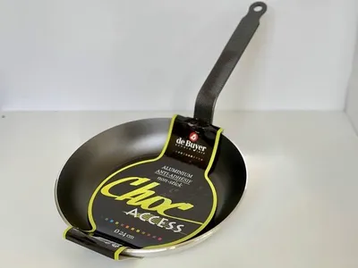 A De Buyer Choc Access frying pan with its packaging tag.