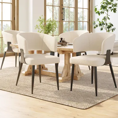 A dining room setting with chairs around a table.