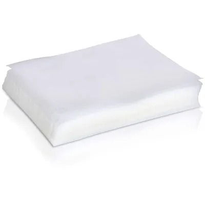A stack of white vacuum seal bags on a white background.