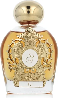 A perfume bottle with ornate gold detailing and amber-colored liquid.