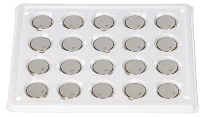 A tray of 20 coin cell batteries.