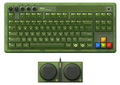 A top-down view of a green mechanical keyboard and a separate green controller with two large circular buttons.