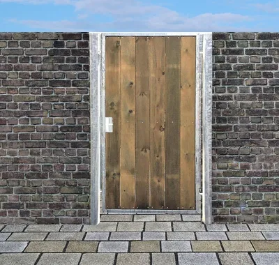 A wooden gate set within a brick wall, with a paved walkway in the foreground.