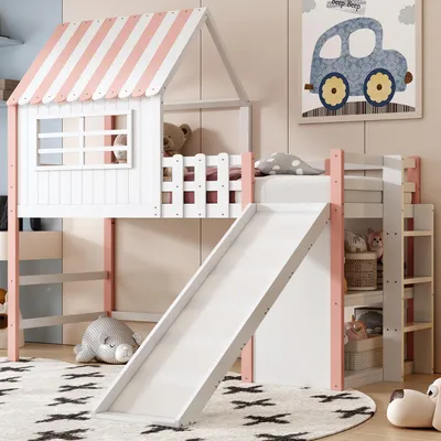 A child's loft bed with a slide and a playhouse-like structure, decorated with pink and white stripes. The bed is set up in a room with a rug and a framed picture on the wall.