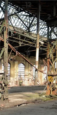 Produktbild von Wallario Design Wanduhr bedruckt, Größe 30 x 60 cm, Motiv: Verlassene Industriehalle - Alte Fabrik