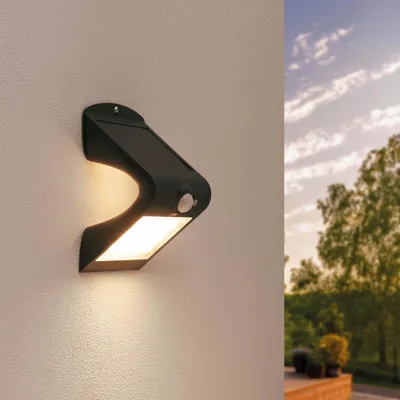 Produktbild von Ledvion - Moderne Solar LED Wandlampe, 1.5W, 3000K, IP65, Schwarz, 220 Lumen, Mit Bewegungssensor, Solarenergie, Energieeffizient & Wetterbeständig