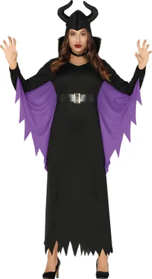 A woman wearing a black and purple witch costume with horns, standing against a white background.