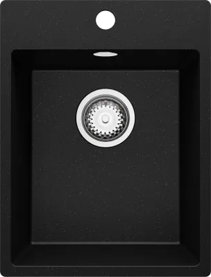 A top-down view of a black granite kitchen sink with a silver drain.