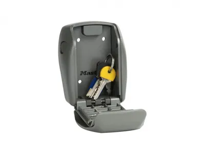 A gray key safe with keys inside, shown against a white background.