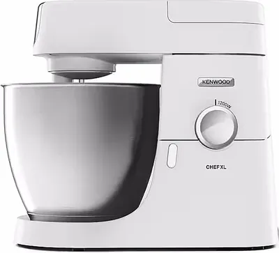 A white Kenwood Chef XL food processor with a silver bowl is shown against a white background.