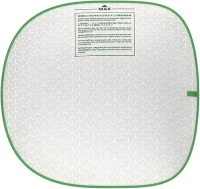 A circular white mat with a green border and a geometric pattern. A text box with instructions is present on the upper right side.
