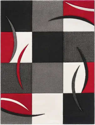A close-up, flat lay view of a modern rug with a geometric wave design.