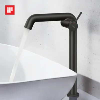 A black faucet with water running into a white sink.
