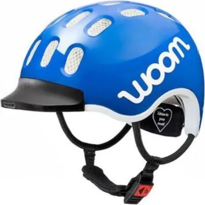 A blue woom kids bicycle helmet with white lettering and a black visor.