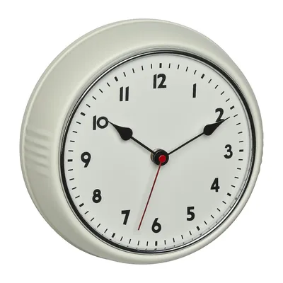 A close-up, angled view of a vintage-style analog wall clock against a white background.