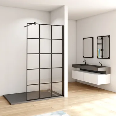 A modern bathroom with a walk-in shower and a double vanity.