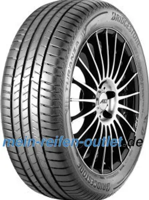 A close-up studio shot of a Bridgestone Turanza T005 tire mounted on a black and silver alloy wheel.