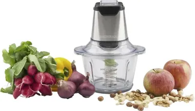 A food chopper is displayed with various ingredients like radishes, onions, peppers, apples, and nuts, suggesting its use for food preparation.
