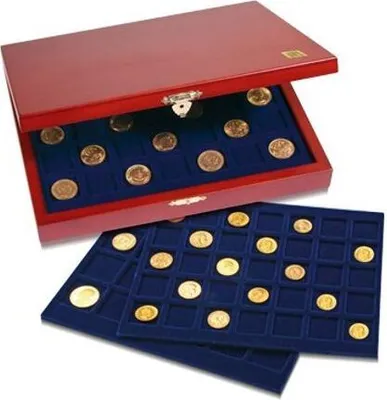 A wooden box with a lid open, revealing trays of coins inside. Two trays are also shown outside the box, also filled with coins.
