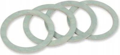 Four light green circular gaskets are arranged in a row on a white background.