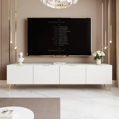 A modern living room with a white TV stand and a large television displaying credits.