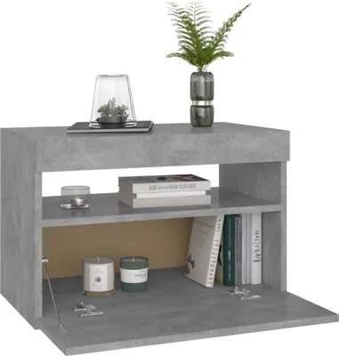 A gray bedside table with shelves, books, and candles.