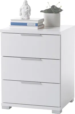 A white three-drawer nightstand with decorative items on top.