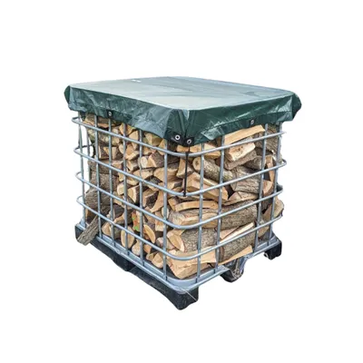 A stack of firewood covered by a green tarp, contained within a metal cage.