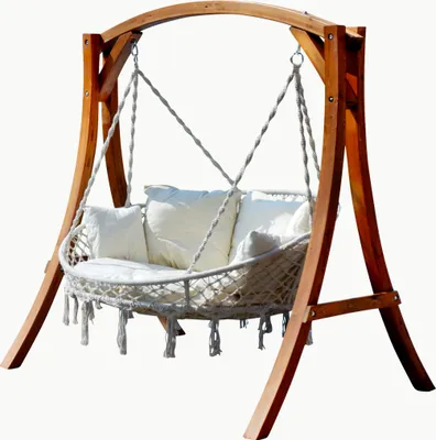 A wooden framed hanging chair with white cushions and macrame detailing, set against a white background.