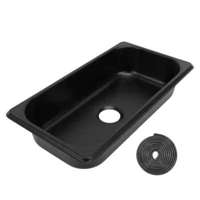 A black RV sink and a roll of sealant.