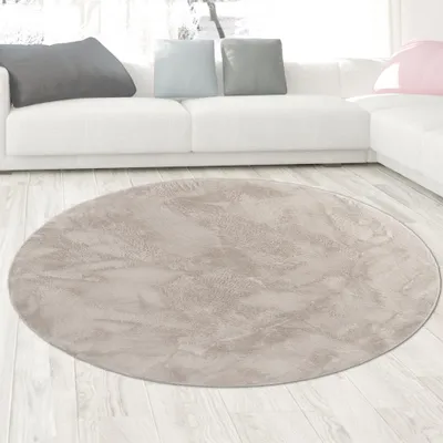 Immagine prodotto di Tappeto in pelliccia di coniglio beige dall'aspetto elegante e morbido, con raffinati riflessi moderni Dimensioni - 120 cm rotondo