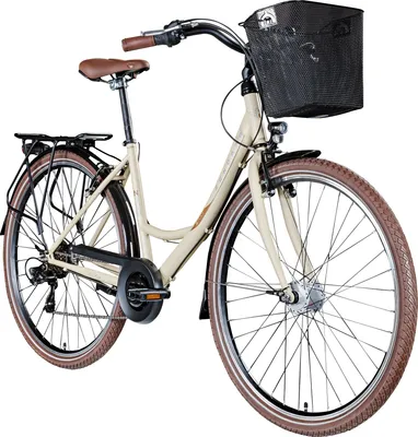 A studio shot of a beige bicycle with a black basket and brown accents.