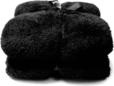 A black plush blanket folded and tied with a black ribbon.
