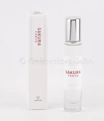 A perfume bottle and its packaging are displayed against a white background.