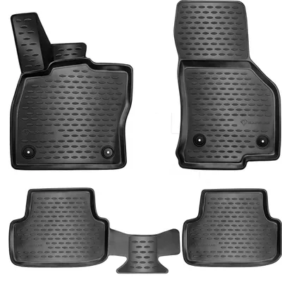 A set of black rubber car floor mats arranged on a white background.