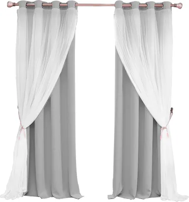 Two gray curtains with white sheer overlays are hung on a curtain rod.