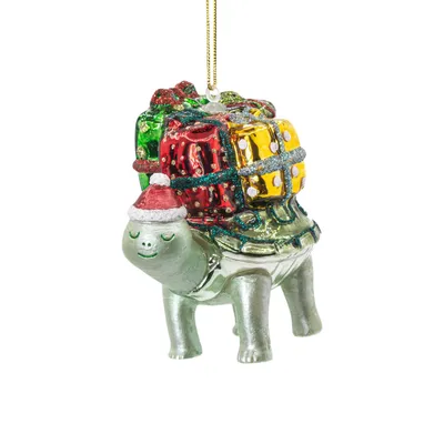 A Christmas ornament shaped like a turtle carrying gifts on its back.