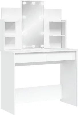 A white vanity table with a lighted mirror and shelves.